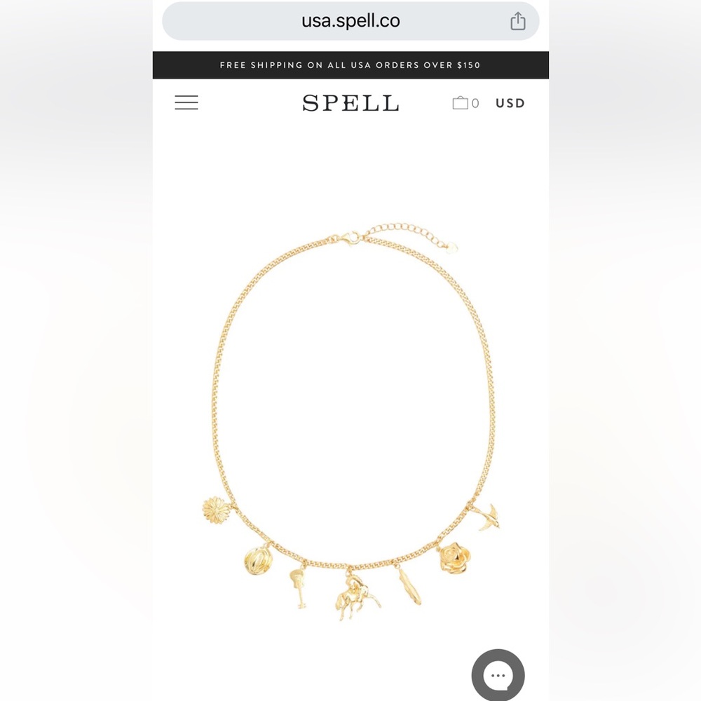 Spell Meadowland gold charm necklace.   New in plastic wrap.